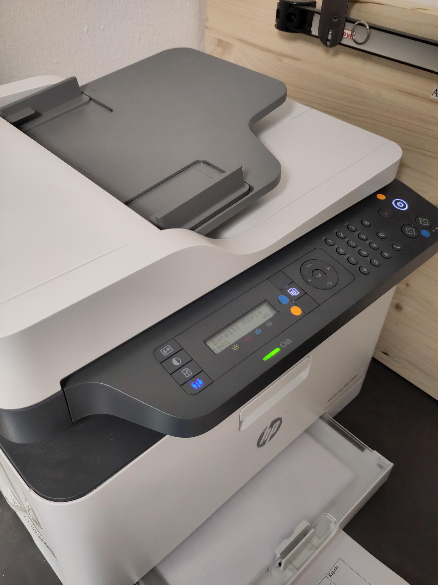 A HP printer showing ready